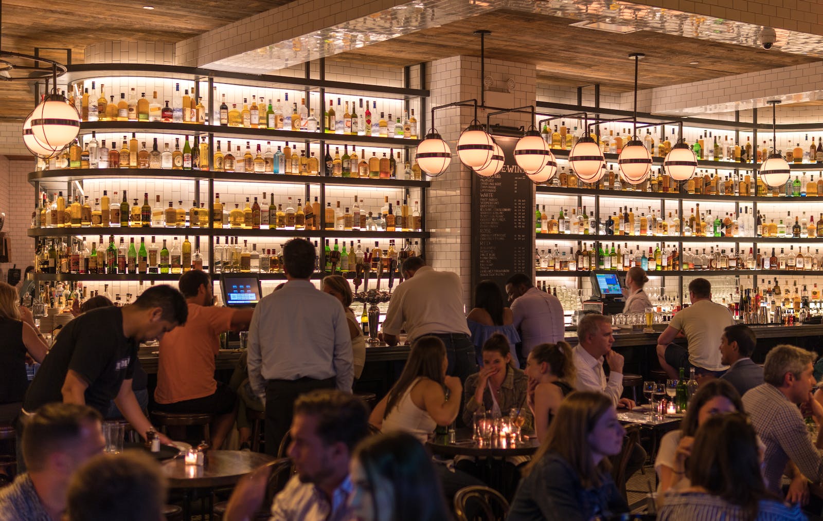 Group of People Gathering Inside Bar