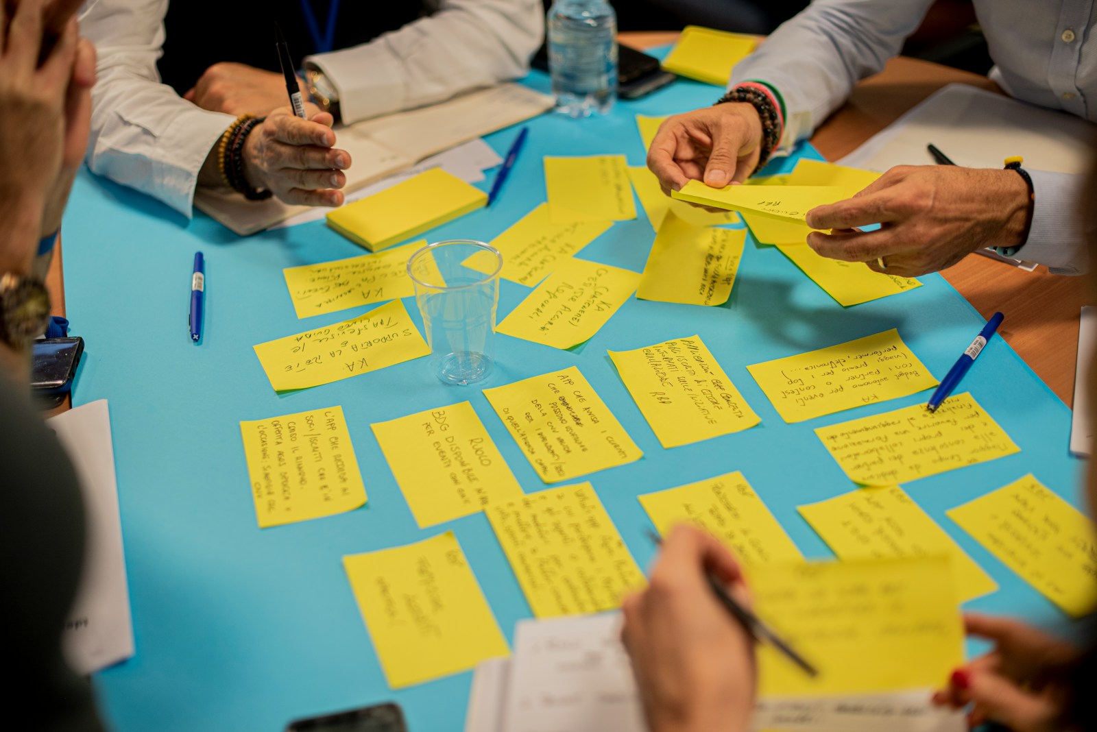 person holding yellow sticky notes